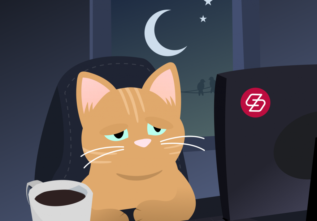 A beige striped cat sitting at a computer desk with a cup of coffee and the moon and stars shining in the night sky through the window behind them. The cat looks very sleepy.